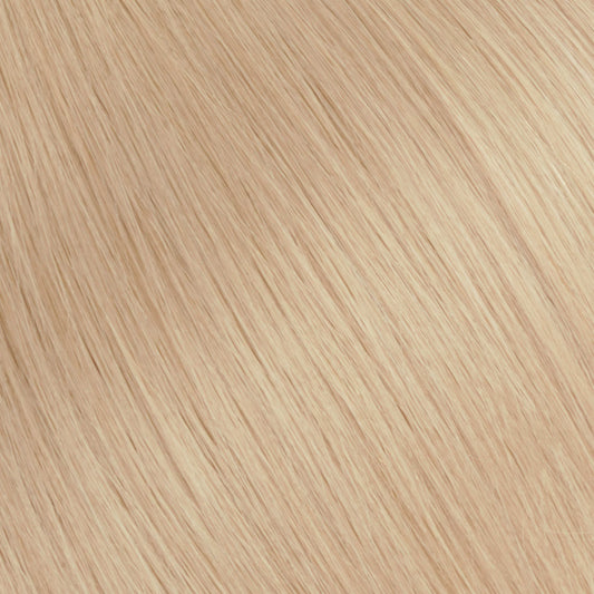 A soft strawberry blonde with subtle peach undertones.
Feminine, luminous, and quietly statement-making.