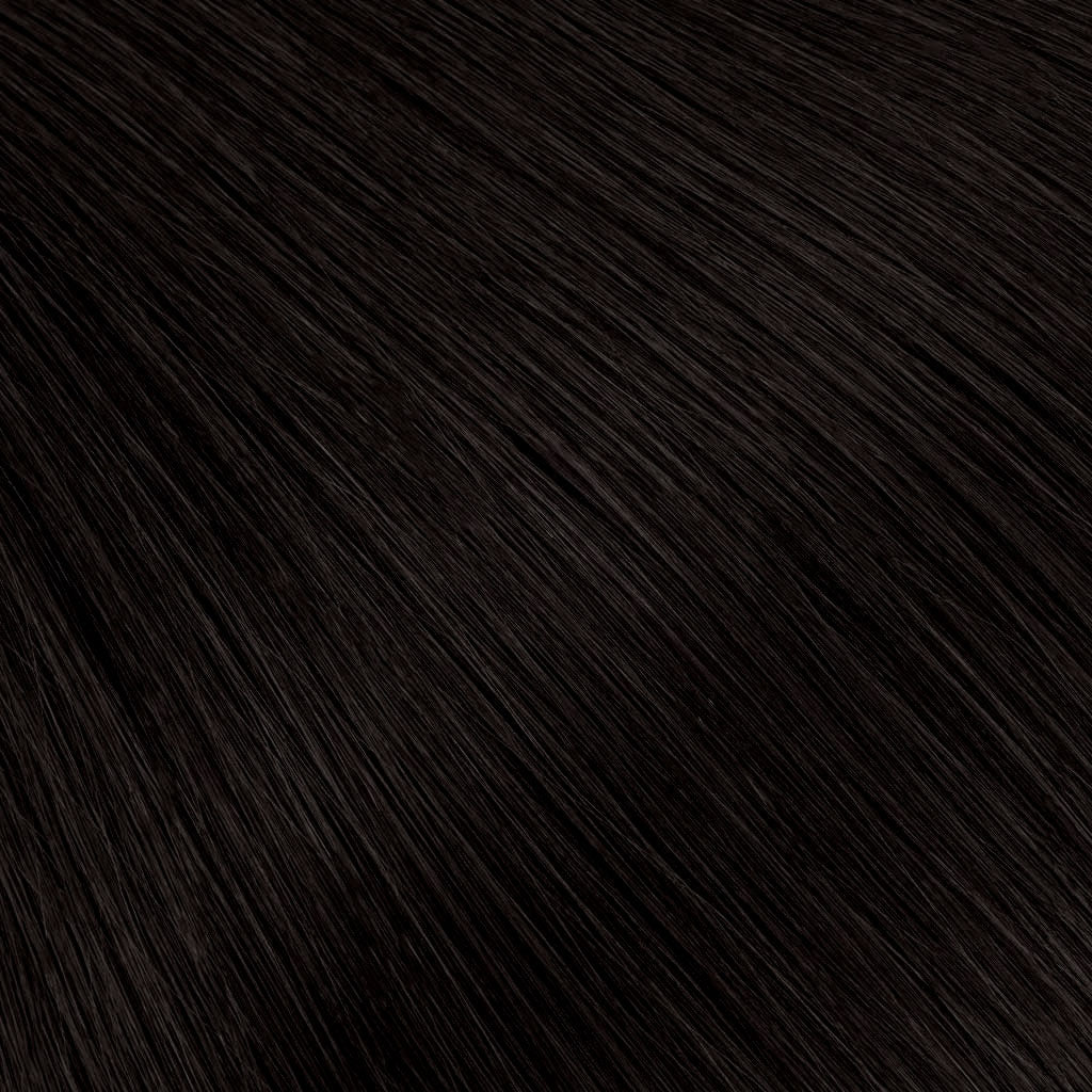 A soft natural black with the faintest warm undertone — richer and more dimensional than pure black, without reading overly dark.
The most wearable dark shade, designed to blend seamlessly across a range of natural hair tones.