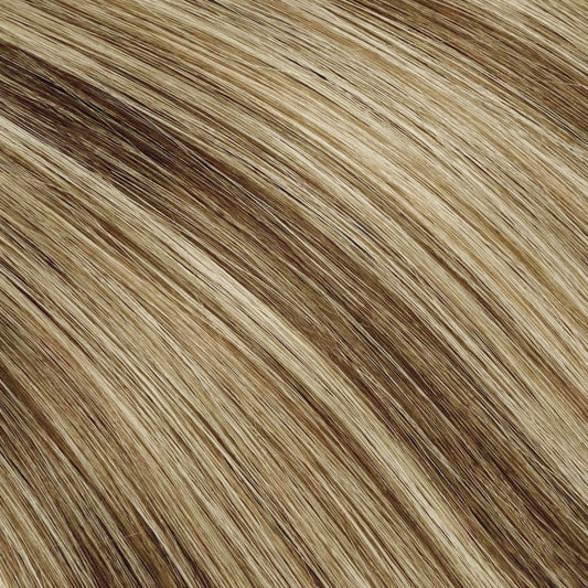 A medium brown with soft blonde highlights.
Everyday wearable dimension without going blonde.